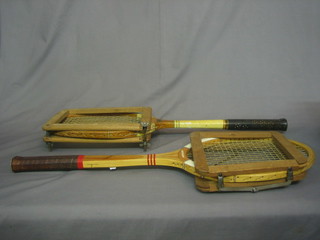 A Wyndham Ewens Olympic tennis racquet complete with press together with a Dunlop Maxfly tennis racquet with press