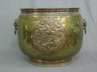 A large circular copper and brass planter with lion mask handles 16"