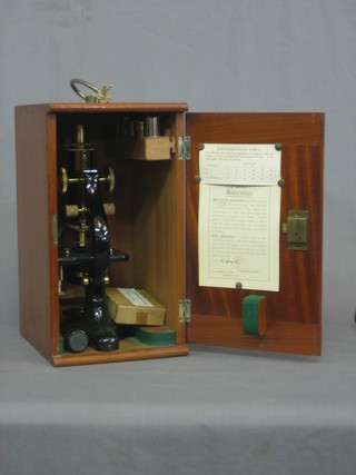 A Charles Gerry single pillar microscope number 5 with 5 lenses and certificate dated 10.10.34