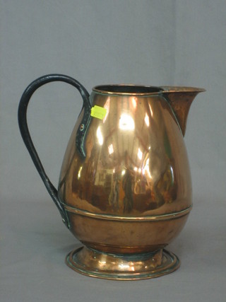 An Art Nouveau copper jug with wrought iron handle 9 1/2"