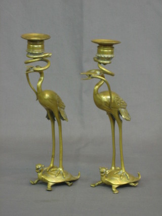 A pair of 19th Century Japanese gilt metal figures of storks standing on turtles 11"