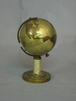 A 1950's cigarette dispenser in the form of  a Globe 8"
