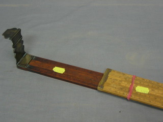 A mahogany and brass Customs and Excise dip measure, marked Bate London, makers to Excise and Customs and 1 other rule marked Farrow & Jackson Ltd London