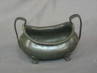 A Georgian pewter twin handled sugar bowl raised on 4 bun feet 6"
