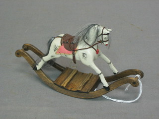 A dolls house rocking horse