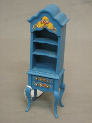 A dolls house French style blue painted bookcase fitted shelves, the base fitted 2 long drawers and raised on cabriole supports 2"
