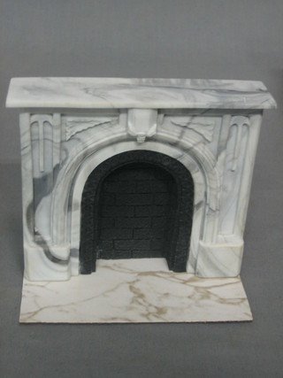 A dolls house marble effect fire surround 5"