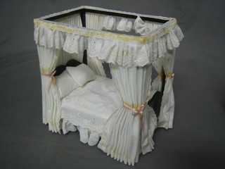 A dolls house 4 poster bed complete with drapes 5"
