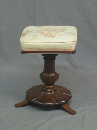 A William IV mahogany revolving square piano stool, raised on a floral base