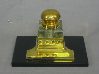 An Art Nouveau square glass ink well on a black glass and brass base 6"