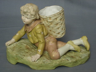 A Royal Dux figure of a reclining boy with basket panier, base with pink Royal Dux triangle mark and impressed 1547 10"