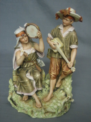 A  Royal Dux style figure of 2 peasant minstrels 9 1/2"