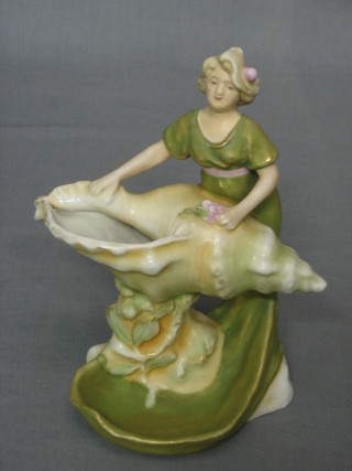 A Royal Dux figure of a girl by a shell, base with Royal Dux pink triangle mark and impressed 814 6 1/2" (R)