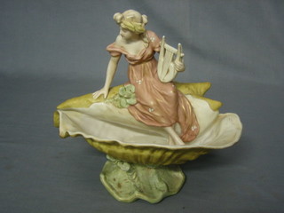 A Royal Dux figure in the form of a seated girl with lyre 10" the base with pink Royal Dux triangle mark and impressed 1932