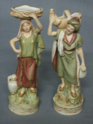 A pair of Royal Dux figures of a standing Turkish man and lady 7"