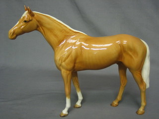 A Beswick figure of a standing Palomino horse 11"
