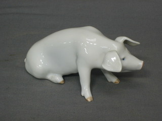 A Royal Copenhagen figure of a seated pig, base marked 1400 5"