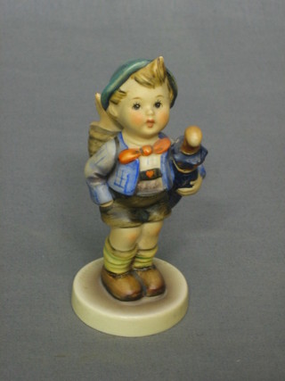 A Goebel figure of a standing boy with umbrella, base impressed 188 1948, 5"