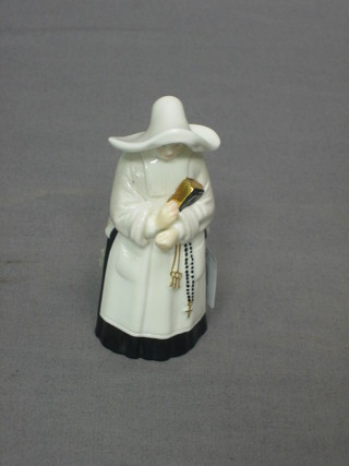 A Royal Worcester candle snuffer in the form of a nun, base with black Royal Worcester mark 3 1/2"