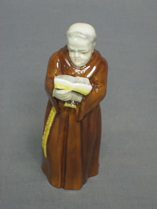 A Royal Worcester candle snuffer in the form of a standing monk, base with black Royal Worcester mark (slight chip to base) 5"