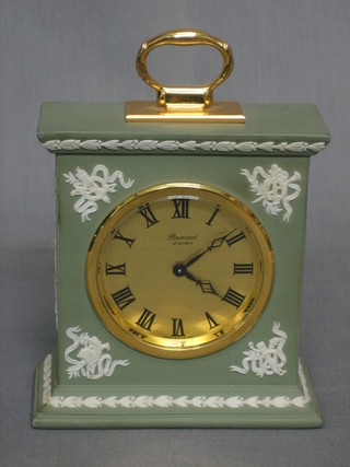 A mantle clock contained in a Wedgwood green Jasperware case 6"