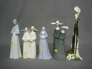 2 Spanish porcelain figures of nuns and 2 others