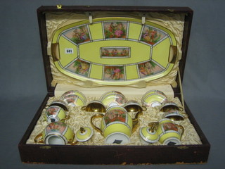 A Continental 16 piece cabaret set comprising oval twin handled tray, coffee pot, lidded sugar bowl and cream jug and 6 cups and 6 saucers, base marked Qual porcelain, cased