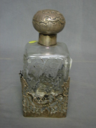 A  Continental etched and cut glass spirit decanter with embossed silver lid and liner