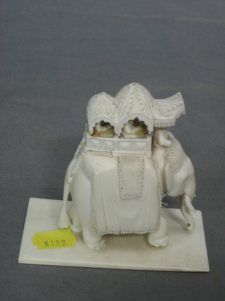 A carved ivory figure of an elephant with attendants 3" (f)