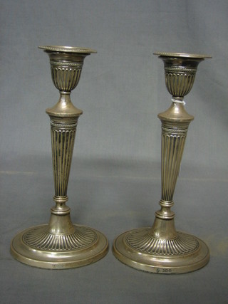 A pair of Adams style silver candlesticks with detachable sconces and reeded columns Sheffield 1914, 10"