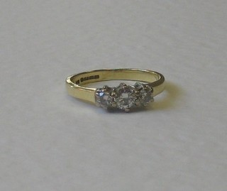 A lady's 18ct yellow gold dress/engagement ring set 3 diamonds