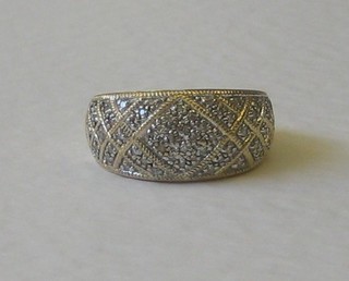 A lady's 18ct gold dress ring set numerous diamonds