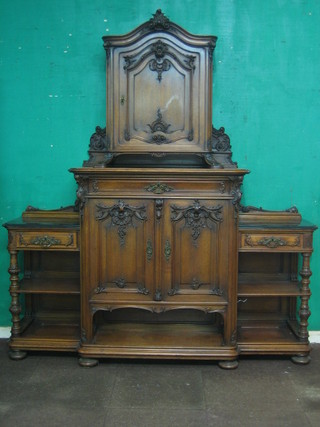 A handsome "German" carved walnut side cabinet, the centre section with raised back fitted a cupboard enclosed by panelled door above 1 long drawer, the base fitted a cupboard enclosed by a panelled door with undertier flanked by 2 marble panels to the side with a drawer above 2 recesses 76"
