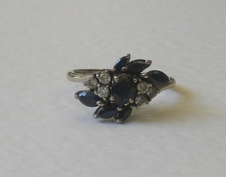 An 18ct white gold dress ring set sapphires and diamonds