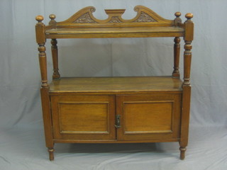 A Victorian oak buffet with raised back and three-quarter gallery, the base fitted a cupboard 39"