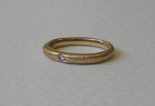 A gold dress ring set a diamond