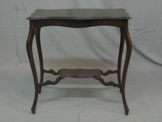An Edwardian rectangular mahogany 2 tier occasional table raised on cabriole supports 26"