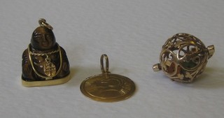 A gold charm engraved Aries the Ram, a gold and hardstone charm in the form of a seated Buddha and a "gold" charm in the form of a bingo wheel