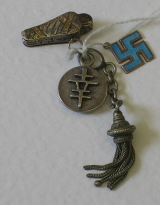 A blue enamelled Swastika pendant, a Chinese good luck pendant, a pendant in the form of a Mummy and a tassel pendant