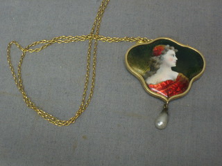 A handsome Art Nouveau Limoges porcelain pendant decorated a lady, the base hung a pearl contained in a gilt metal frame signed L Joubert, hung on a gilt chain