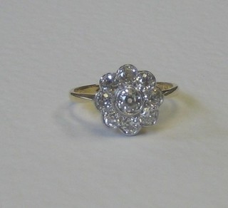 A lady's 18ct floral cluster dress ring set 9 old cut diamonds, approx 1.20ct