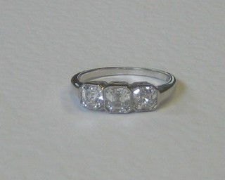 A lady's Art Deco style 18ct white gold dress ring set 3 square cut diamonds, approx 1.61ct