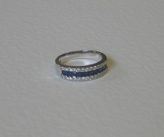 A lady's 18ct white gold half eternity ring set sapphires and diamonds