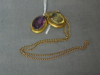 An amethyst pendant in gilt metal mounts and a green glass pendant hung on a gold chain