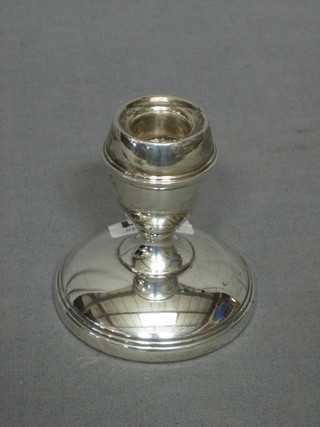 A silver stub shaped candlesticks 3"