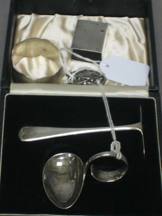 A Ludovic I of Portugal silver coin brooch dated 1881, a silver match slip, a silver napkin ring and a childs silver pusher and spoon cased