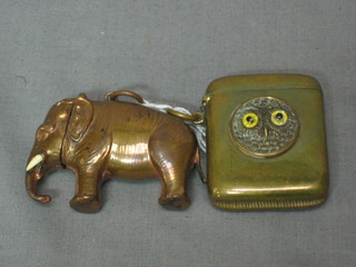 A brass vesta case in the form of a standing elephant and 1 other vesta case decorated an owl (2)