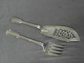 A pair of Victorian silver fiddle and thread pattern fish servers with armorial decoration, London 1853 10 ozs