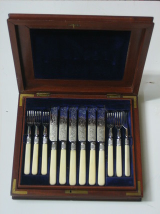 A part silver plated fruit service contained in a walnut canteen box