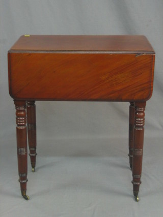 A Victorian mahogany drop flap occasional table, fitted 2 drawers, raised on turned supports ending in brass caps and castors, 24"